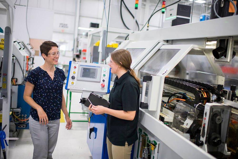 GVSU professor with student at an engineering co-op.